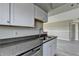 Modern kitchen featuring granite countertops, stainless steel dishwasher and gray tone cabinets at 795 Hammond Dr # 1108, Atlanta, GA 30328
