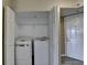 Convenient laundry area features a stacked washer and dryer unit in the hallway closet at 795 Hammond Dr # 1108, Atlanta, GA 30328