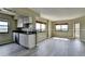 Spacious living room features an open floor plan with large windows and wood flooring at 795 Hammond Dr # 1108, Atlanta, GA 30328