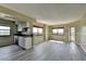 Spacious living room features an open floor plan with large windows and wood flooring at 795 Hammond Dr # 1108, Atlanta, GA 30328