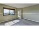 Bright Living room features gray tone flooring, neutral color walls, natural light, and a patio exit at 795 Hammond Dr # 1108, Atlanta, GA 30328