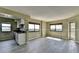 Bright Living room features gray tone flooring, neutral color walls, natural light, with kitchen in the background at 795 Hammond Dr # 1108, Atlanta, GA 30328