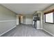 Bright Living room features gray tone flooring and neutral color walls with kitchen in the background at 795 Hammond Dr # 1108, Atlanta, GA 30328
