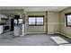 Bright Living room features gray tone flooring, neutral color walls, natural light, with kitchen in the background at 795 Hammond Dr # 1108, Atlanta, GA 30328
