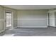Bright Living room features gray tone flooring, neutral color walls and a patio exit at 795 Hammond Dr # 1108, Atlanta, GA 30328