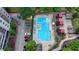 Aerial view of a community pool with lounge chairs and covered cabanas at 795 Hammond Dr # 1108, Atlanta, GA 30328
