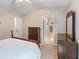 Comfortable bedroom with neutral tones, traditional furnishings, and an ensuite bathroom entrance at 805 Pleasant Hill Nw Rd # 231, Lilburn, GA 30047