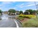 Creekside Manor community entrance with decorative sign and gated access at 805 Pleasant Hill Nw Rd # 231, Lilburn, GA 30047