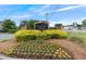 Creekside Manor community entrance sign with colorful flowers and landscaping at 805 Pleasant Hill Nw Rd # 231, Lilburn, GA 30047