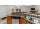 Kitchen featuring stainless steel appliances, wooden cabinets, and an open layout design at 805 Pleasant Hill Nw Rd # 231, Lilburn, GA 30047