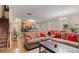 Bright living room with hardwood floors, a comfortable sofa, and an open view to the kitchen at 805 Pleasant Hill Nw Rd # 231, Lilburn, GA 30047