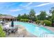 Resort-style pool with ample seating, a clubhouse, lush landscaping, and a relaxing atmosphere at 805 Pleasant Hill Nw Rd # 231, Lilburn, GA 30047