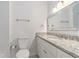 Bright bathroom featuring granite countertops, white cabinets and a toilet at 1230 Piedmont Ne Ave # 405, Atlanta, GA 30309