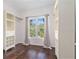 Bright closet featuring custom built-ins, hardwood floors and a large window with peaceful outdoor views at 1230 Piedmont Ne Ave # 405, Atlanta, GA 30309