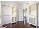 Bright closet featuring custom built-ins, hardwood floors and an open door to the next room at 1230 Piedmont Ne Ave # 405, Atlanta, GA 30309