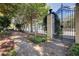 Long view of decorative fence and entry gate leading to community at 1230 Piedmont Ne Ave # 405, Atlanta, GA 30309