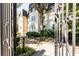 Exterior view of building, showcasing a secure gated entrance and beautifully landscaped grounds at 1230 Piedmont Ne Ave # 405, Atlanta, GA 30309