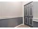 Hallway view by door 405 with neutral two-tone paint and white trim at 1230 Piedmont Ne Ave # 405, Atlanta, GA 30309