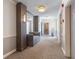 Hallway featuring carpeted floor, sofa seating area, mirrored accent wall, and neutral wall colors at 1230 Piedmont Ne Ave # 405, Atlanta, GA 30309