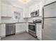 Close-up of the kitchen featuring stainless steel appliances and white cabinets at 1230 Piedmont Ne Ave # 405, Atlanta, GA 30309