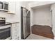 Kitchen view with stainless steel fridge open to living area at 1230 Piedmont Ne Ave # 405, Atlanta, GA 30309