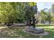 Outdoor view of a metal sculpture in a tree-filled park on a sunny day, showcasing the beauty of public art at 1230 Piedmont Ne Ave # 405, Atlanta, GA 30309