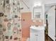 Bright bathroom features a tiled shower, stylish vanity, and charming cactus-themed shower curtain at 5400 Francis Ave, Stone Mountain, GA 30087