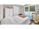 Cozy bedroom features a comfortable bed, closet, ample natural light, and charming decor at 5400 Francis Ave, Stone Mountain, GA 30087