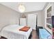 Comfortable bedroom with natural light, closet, and charming decor elements enhance the inviting space at 5400 Francis Ave, Stone Mountain, GA 30087