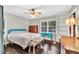 Bedroom features a ceiling fan, hardwood floors, and closet at 5400 Francis Ave, Stone Mountain, GA 30087