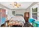 Bedroom featuring hardwood floors, ceiling fan, and natural light at 5400 Francis Ave, Stone Mountain, GA 30087