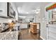 View of kitchen featuring stainless appliances, granite countertops, hardwood floors, and view to living area at 5400 Francis Ave, Stone Mountain, GA 30087