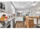 Bright kitchen with stainless steel appliances, white cabinets, granite countertops, and hardwood floors at 5400 Francis Ave, Stone Mountain, GA 30087