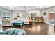 Spacious living room showcasing hardwood floors and an open layout into the kitchen and dining area at 5400 Francis Ave, Stone Mountain, GA 30087