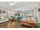 Inviting living room featuring hardwood floors, lots of natural light, and light gray walls at 5400 Francis Ave, Stone Mountain, GA 30087