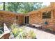 Outdoor patio with mature flowers and seating, perfect for enjoying the natural setting and relaxing outdoors at 5400 Francis Ave, Stone Mountain, GA 30087