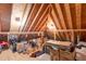 Attic storage area with exposed rafters, storage boxes, and some items, providing ample space at 4801 Deer Chase, Powder Springs, GA 30127