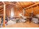 Spacious attic with exposed wood beams, filled with storage boxes and a variety of household items at 4801 Deer Chase, Powder Springs, GA 30127