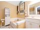 Bright bathroom featuring a soaking tub, white vanity, and stylish decor, creating a spa-like atmosphere at 4801 Deer Chase, Powder Springs, GA 30127