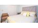 Comfortable bedroom featuring a soft upholstered headboard, side table and closet at 4801 Deer Chase, Powder Springs, GA 30127