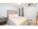 Comfortable bedroom with decoratively patterned bedding, side table, neutral walls, and closet at 4801 Deer Chase, Powder Springs, GA 30127