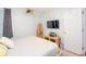 Cozy bedroom featuring a mounted television, full length mirror and decorative shelving at 4801 Deer Chase, Powder Springs, GA 30127