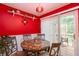 Charming dining room with a marble table, sliding door access to the deck, and stylish decor at 4801 Deer Chase, Powder Springs, GA 30127