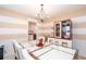 Bright dining room adjacent to the kitchen featuring a stylish chandelier at 4801 Deer Chase, Powder Springs, GA 30127