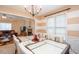 Bright dining room with large windows and decorative chandelier at 4801 Deer Chase, Powder Springs, GA 30127