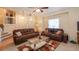 Comfortable living room with plush sofas, stylish rug and staircase access at 4801 Deer Chase, Powder Springs, GA 30127