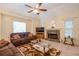 A spacious living room features comfortable seating, a stone fireplace and natural light at 4801 Deer Chase, Powder Springs, GA 30127