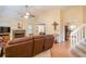 A cozy living room with a stone fireplace, connecting to the kitchen and staircase at 4801 Deer Chase, Powder Springs, GA 30127