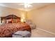Comfortable bedroom showcasing plush bedding, soft carpet, and a cozy recliner, perfect for relaxation at 4801 Deer Chase, Powder Springs, GA 30127