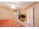 Bedroom features a walk-in closet, neutral walls, a television, and easy access to an adjacent bathroom at 4801 Deer Chase, Powder Springs, GA 30127